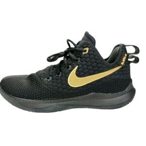 Black Nike Air Gold sneakers